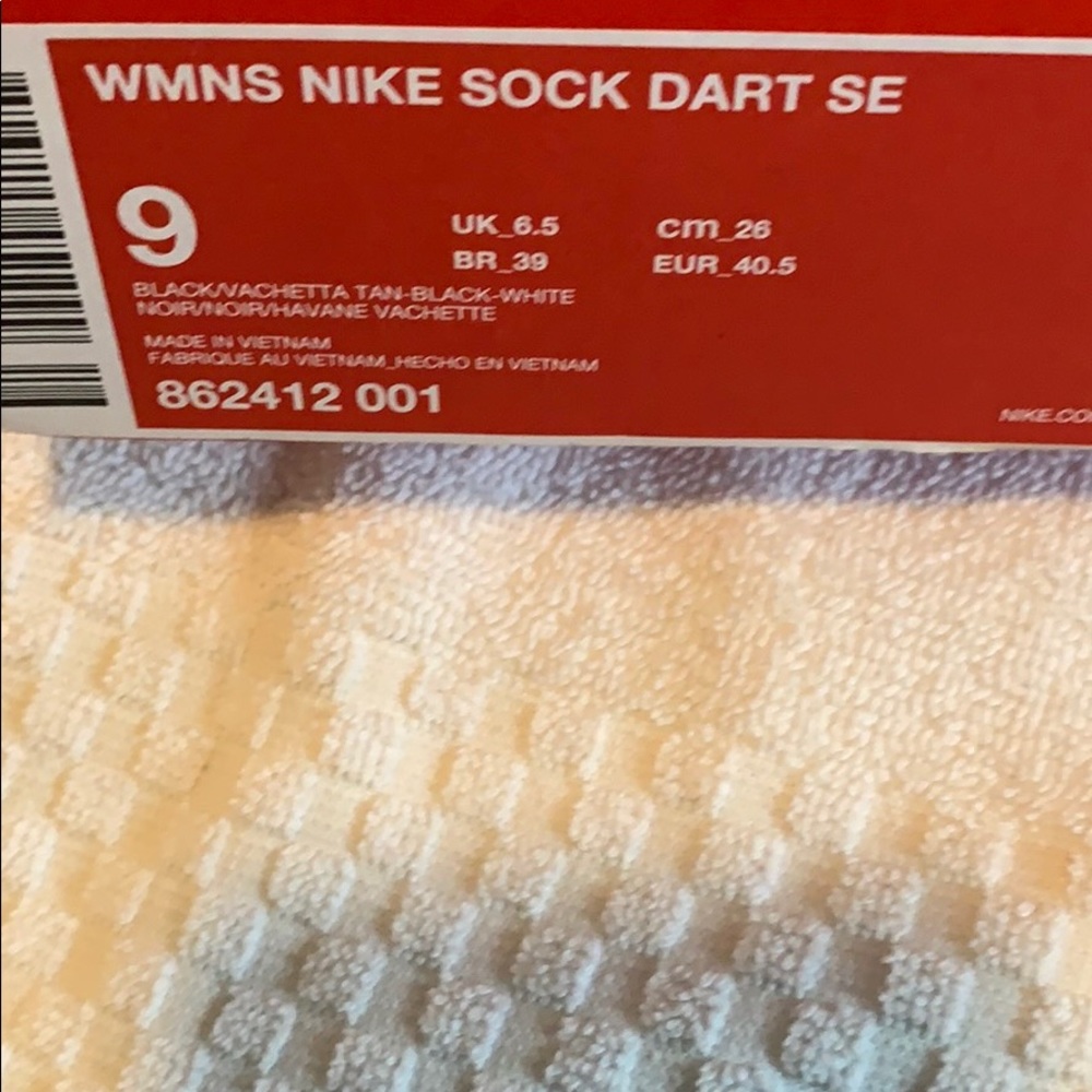 Gray Nike Darts